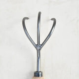 Curved tines of steel cultivator for soil aeration - product image.